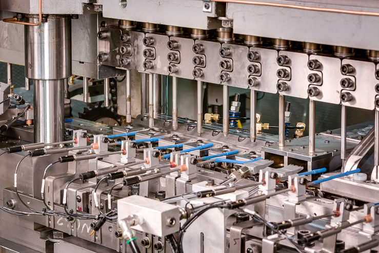 A closeup image of a bullet assembly machine (BAM) showcasing its tooling